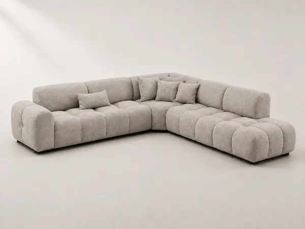Light gray bubble-tufted sofa, three-quarter angle
