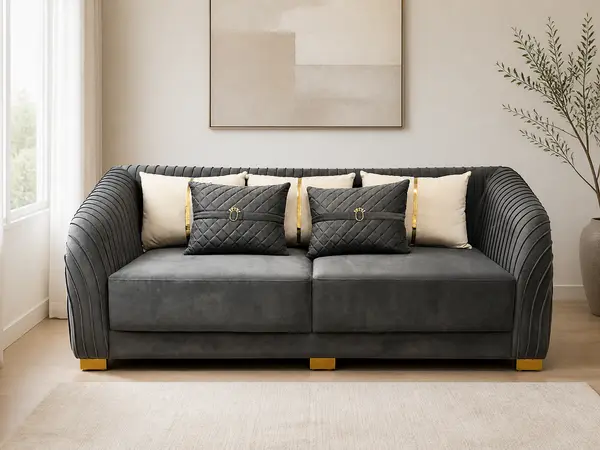 Charcoal velvet pleated-arm loveseat – styled in a living room setting