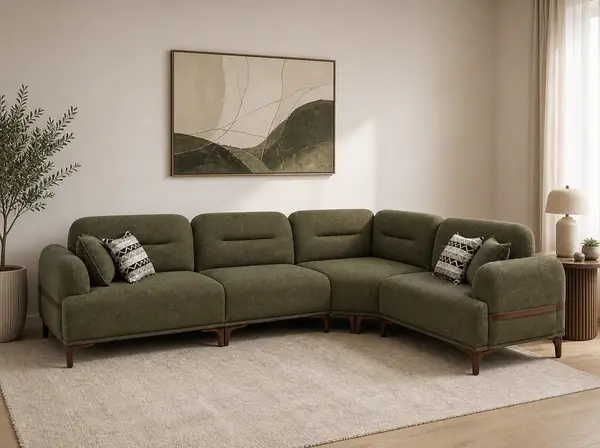 Olive green sofa styled in a living room setting