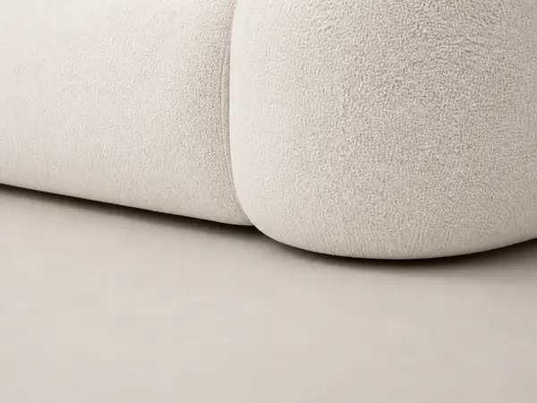 Off-white boucle curved sectional – close-up detail view