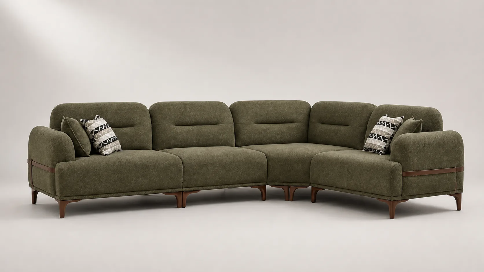 Olive green L-shaped sofa with leather strap arm detail.