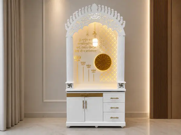 White arched jharokha mandir styled in a home pooja corner
