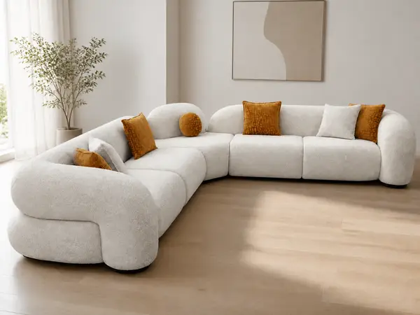 Off-white boucle curved sectional – styled in a living room setting
