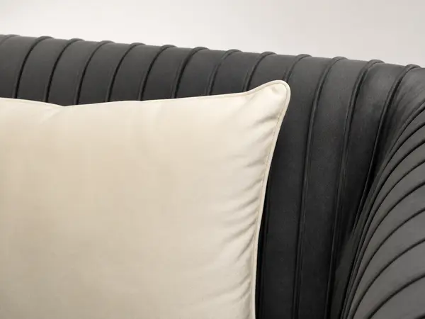 Charcoal velvet pleated-arm loveseat – close-up detail view