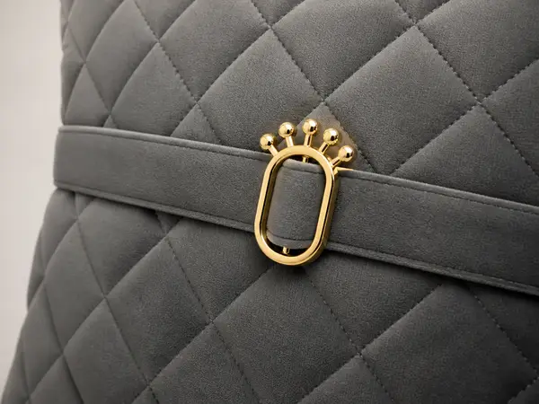 Charcoal velvet pleated-arm loveseat – close-up of pleated arm detail