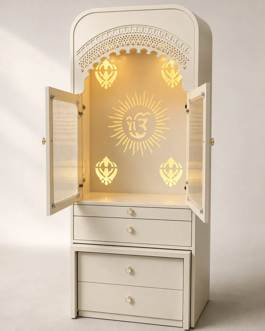 White mandir unit with open jaali doors revealing a gold sunburst Om medallion.