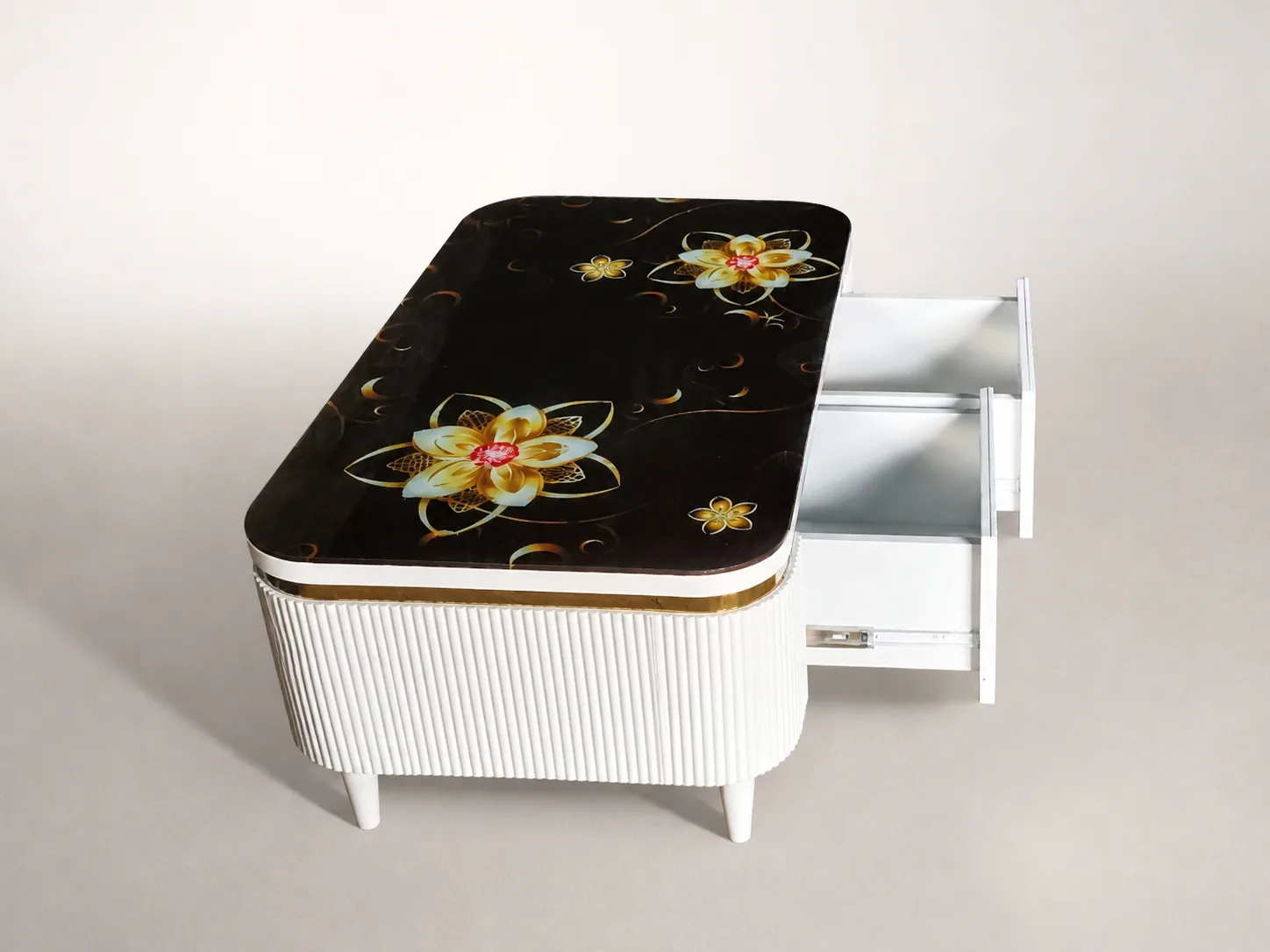 Black center table with gold floral medallion top and white fluted base.
