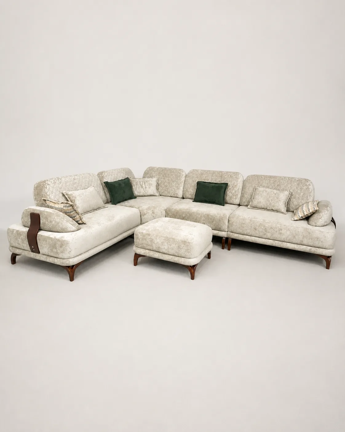 Cream crushed velvet L-shaped sofa with diamond-quilted channel back.