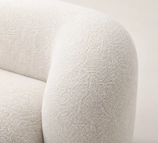 Off-white boucle curved sectional – close-up of boucle texture