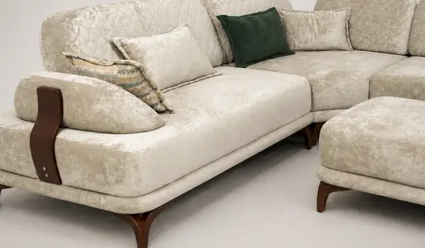 Close-up of diamond-quilted channel tufting on cream velvet