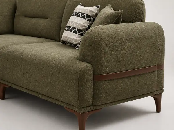 Close-up of leather strap arm detail on olive green sofa
