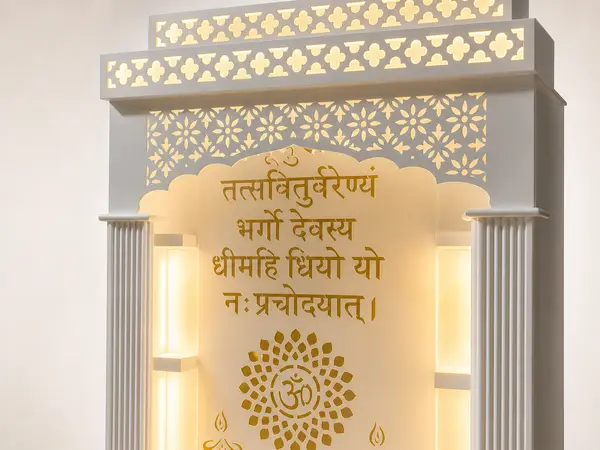 Close-up of the backlit Gayatri mantra arch and gold Om lotus medallion